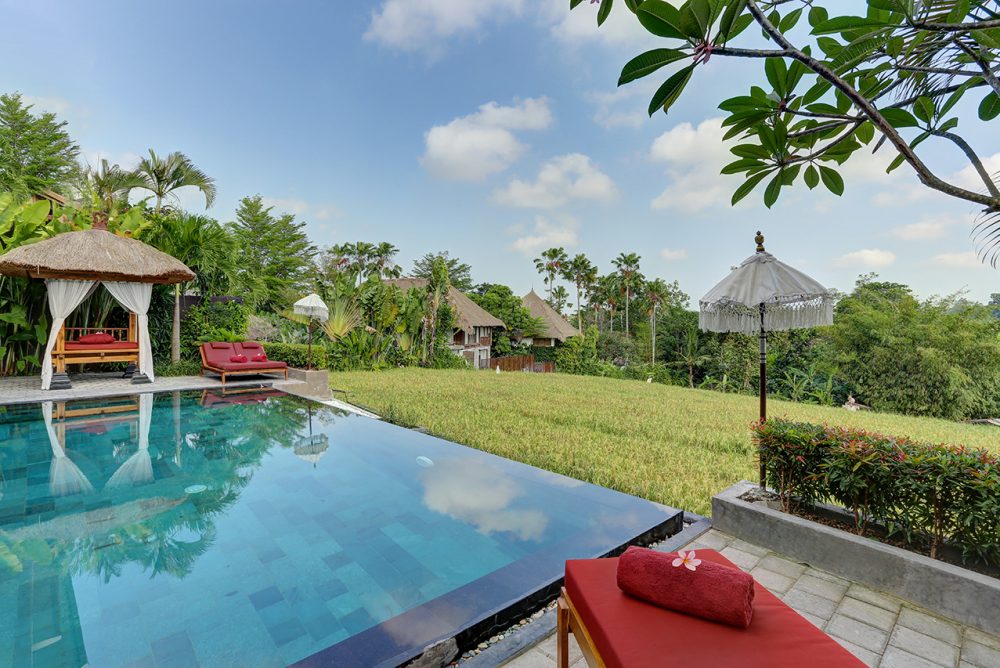 relaxing at the red sundeck facing the pool and the rice fields viewu