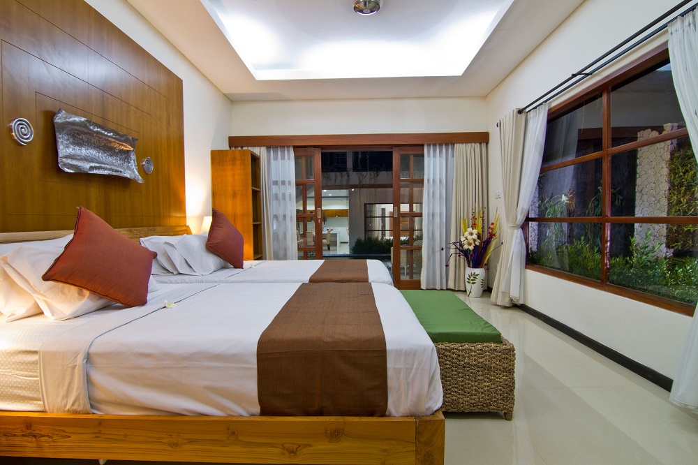 twin bedroom at villa maha with minimalist design - facing to the pool